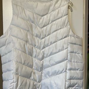 White puffy vest.